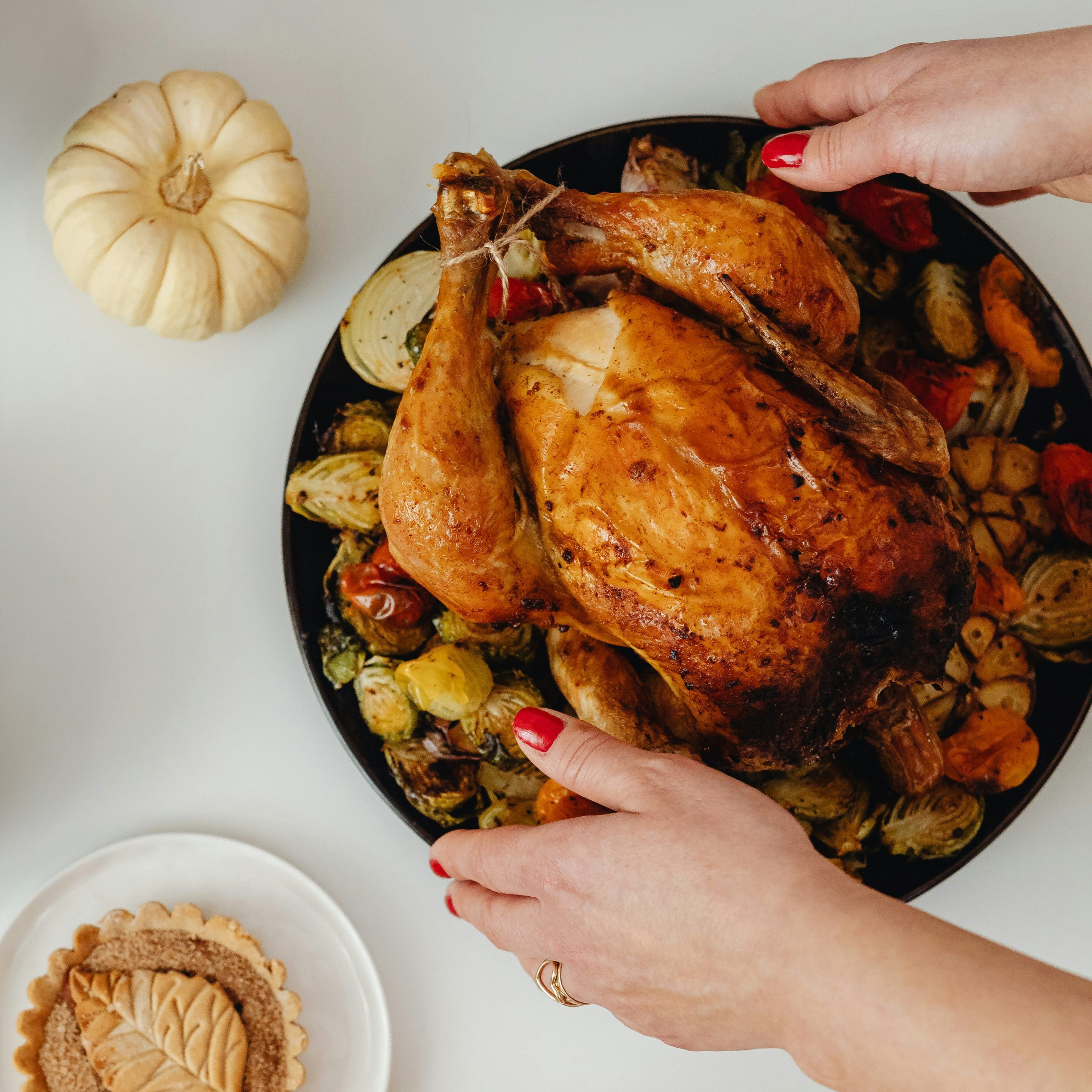 bacon-wrapped hot dogs on a grill